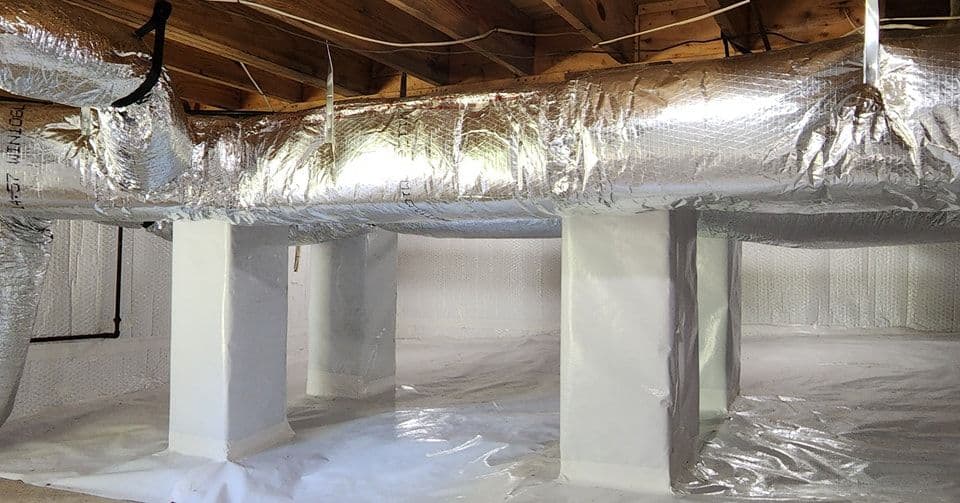 Foam-padded basement with insulated ductwork and clean white flooring for moisture protection.
